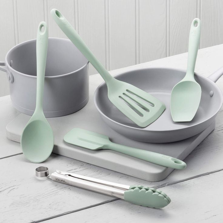 Essential Cooking Accessories - Everyday tools for cooking and baking like spatulas, cutting boards, and whisks.